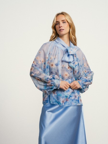 Blouse with flowers and a bow