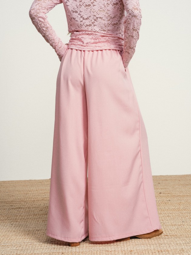 Wide-legged trousers with a flower on the belt Wide-legged trousers with a flower on the belt