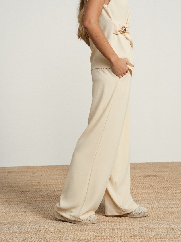 Wide-legged trousers with silver buttons