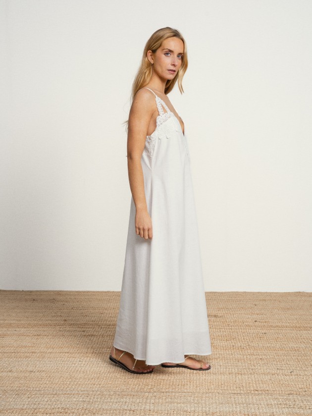 Long cotton dress with a v-neck and english embroidery. Long cotton dress with a v-neck and english embroidery.