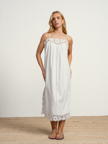 Long linen dress with embroidery and thin straps.