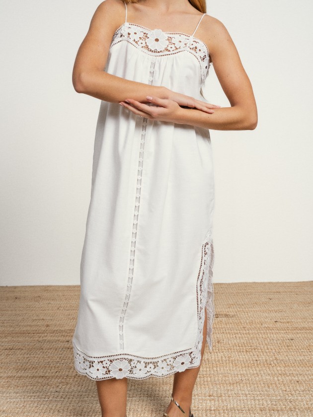Long linen dress with embroidery and thin straps.