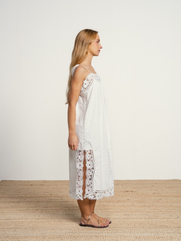 Long linen dress with embroidery and thin straps.