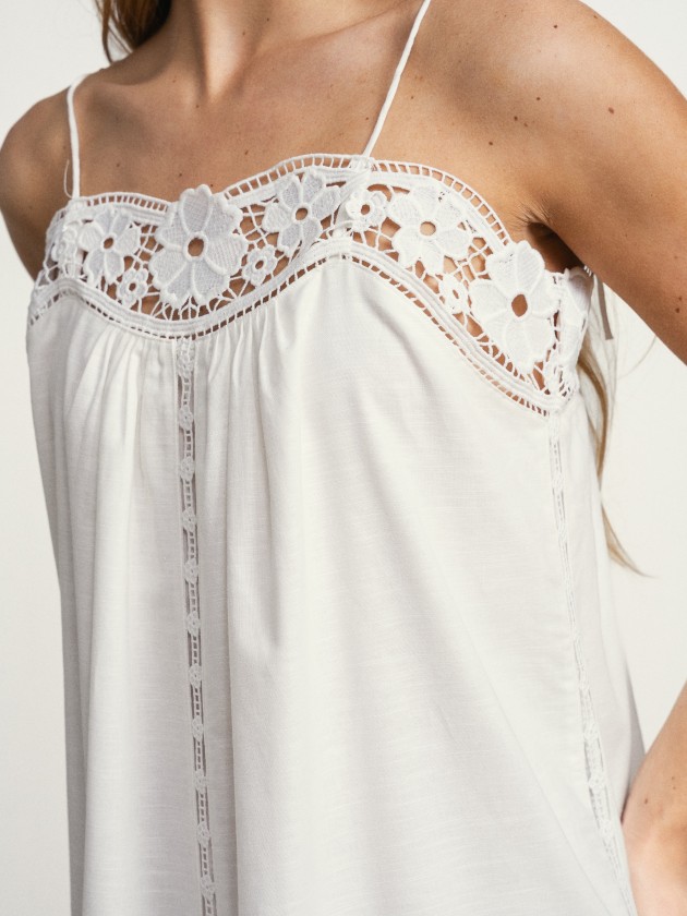 Long linen dress with embroidery and thin straps.
