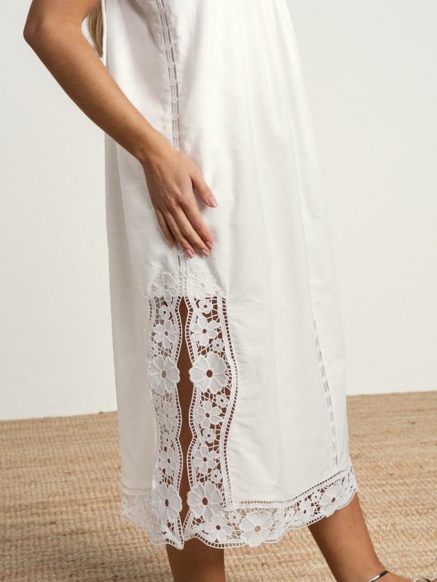 Long linen dress with embroidery and thin straps.