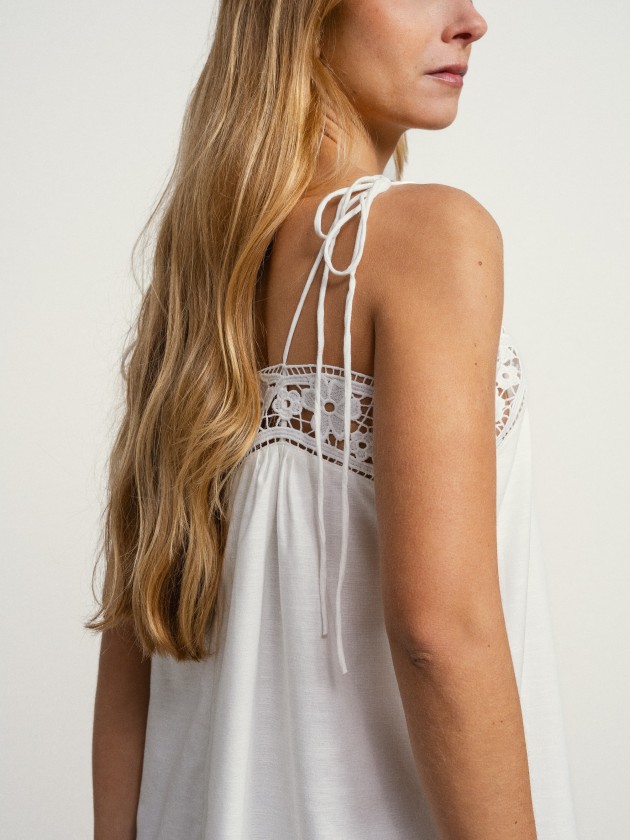 Long linen dress with embroidery and thin straps.