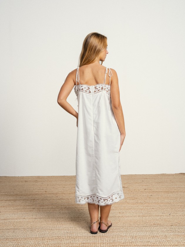 Long linen dress with embroidery and thin straps.