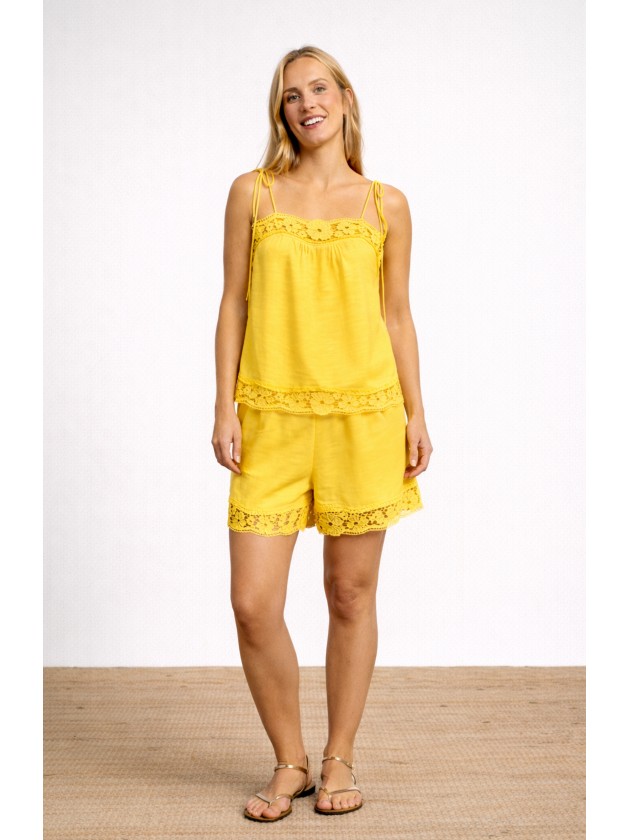 Cotton tank top with thin straps and english embroidery. Cotton tank top with thin straps and english embroidery.