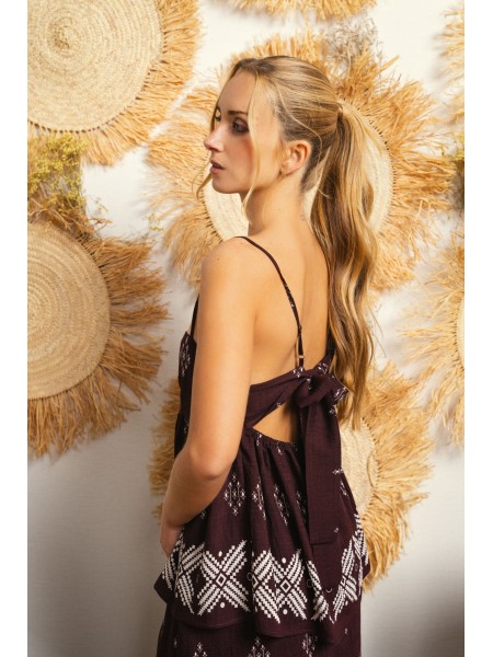 Printed tank top with thin straps and a slightly open back.