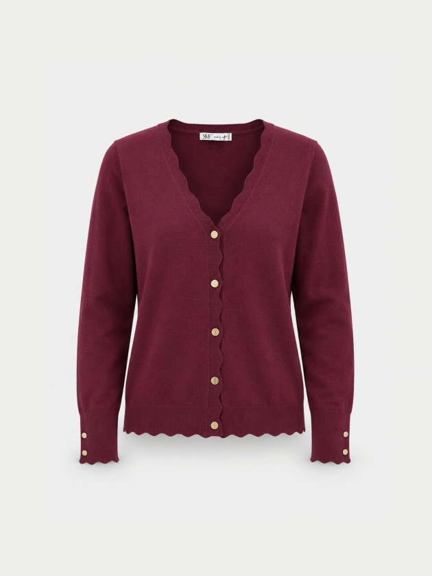 Veste tricot�e � finition ondul�e.