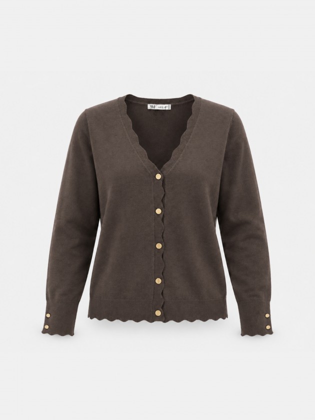 Veste tricot�e � finition ondul�e.