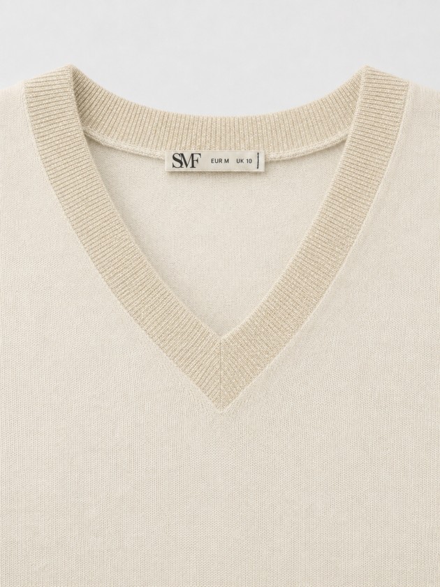 Knitted sweater with a v-neck
