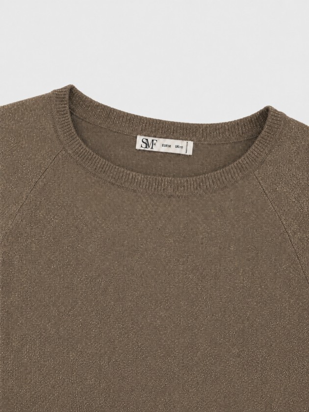 Knitted sweater with metallic thread