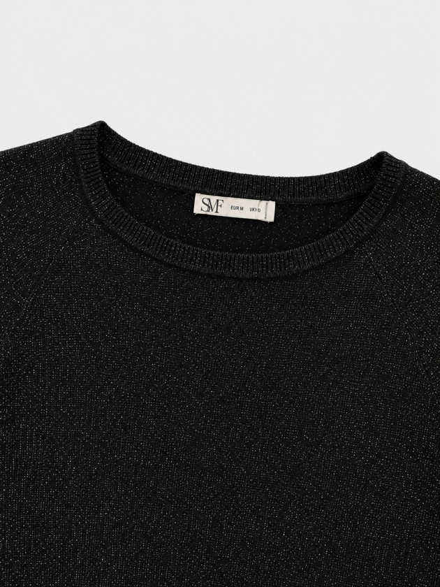 Knitted sweater with metallic thread