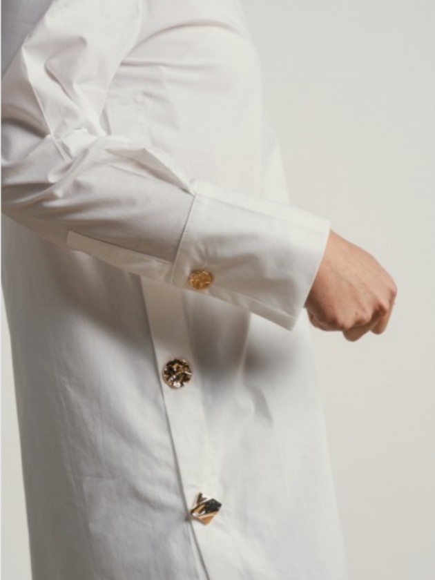 Cotton shirt with gold buttons on the side. Cotton shirt with gold buttons on the side.