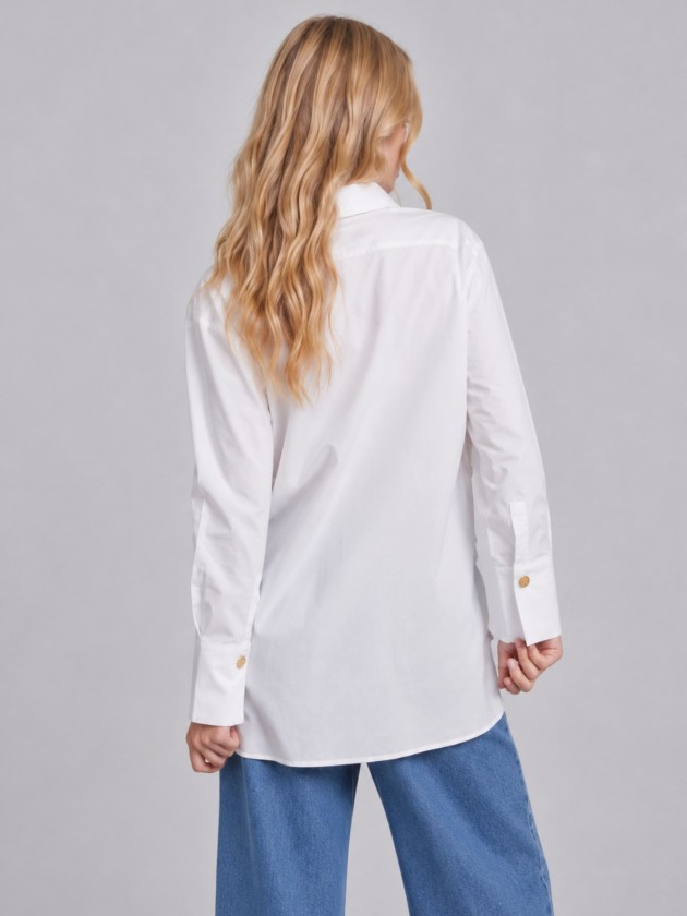 Cotton shirt with gold buttons on the side. Cotton shirt with gold buttons on the side.
