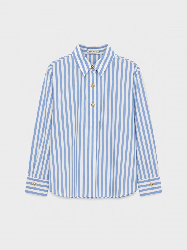 A shirt with rich, metallic buttons. A shirt with rich, metallic buttons.