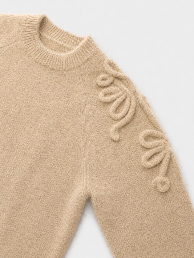 Knitted sweater with embroidery