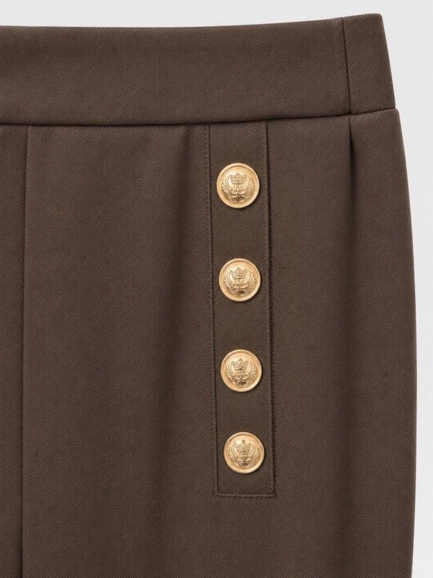 Trousers with metal buttons