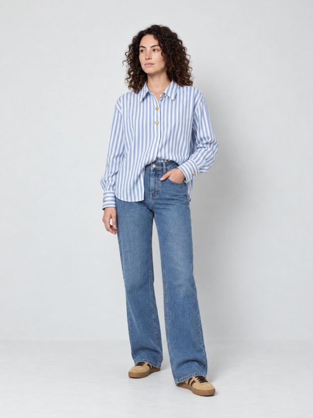 A shirt with rich, metallic buttons. A shirt with rich, metallic buttons.