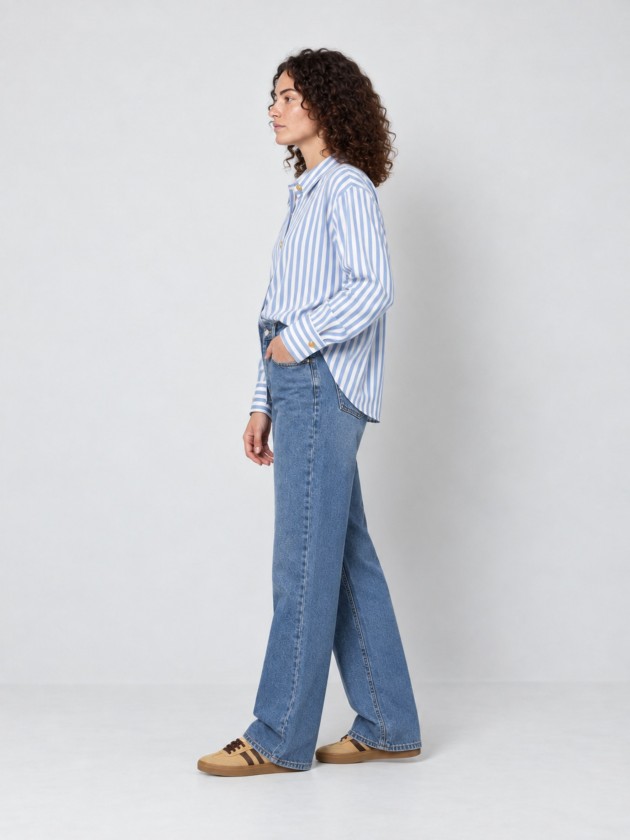 A shirt with rich, metallic buttons. A shirt with rich, metallic buttons.