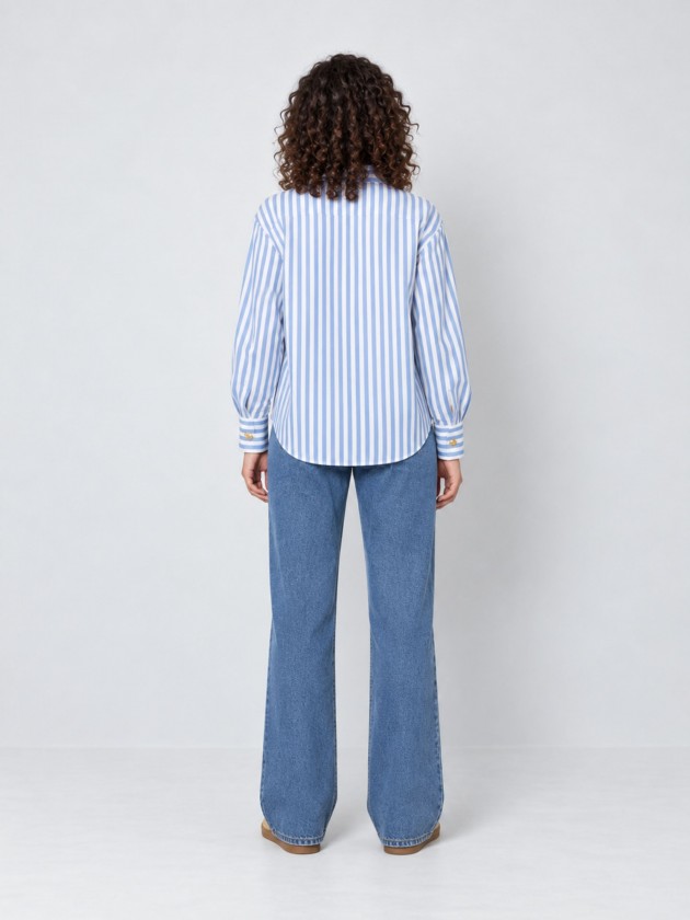 A shirt with rich, metallic buttons. A shirt with rich, metallic buttons.