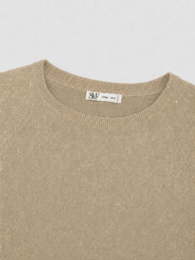 Knitted sweater with metallic thread
