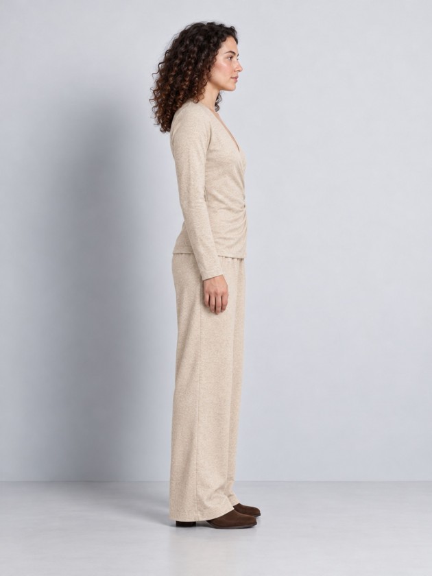 Knitted sweater with draping