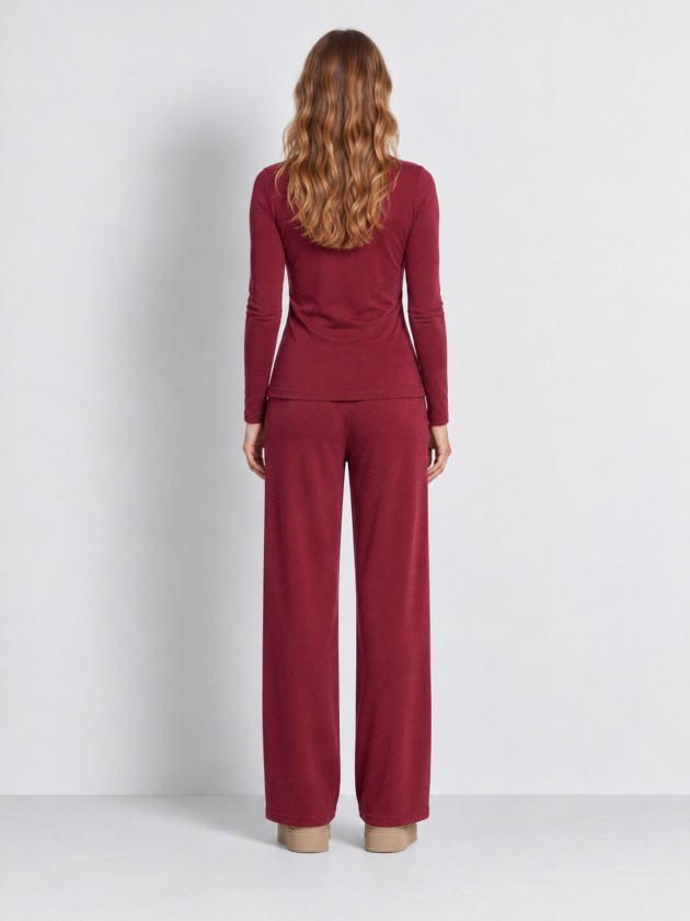 Knitted sweater with draping