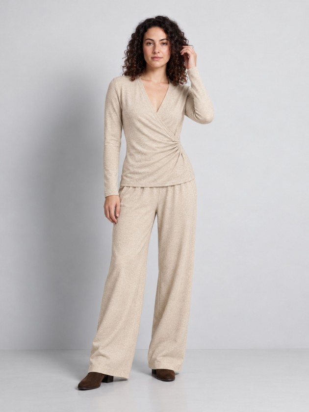 Knitted sweater with draping