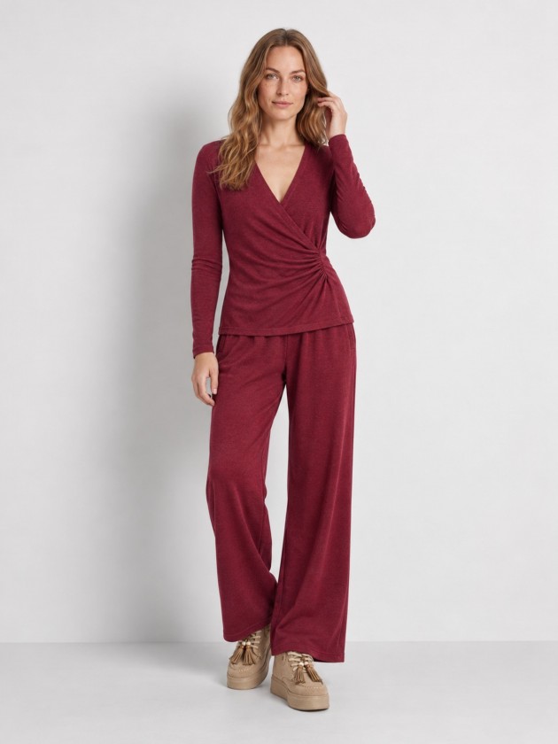 Knitted sweater with draping