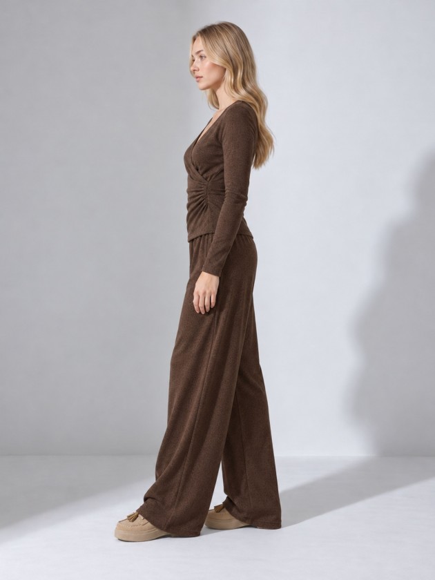 Knitted sweater with draping